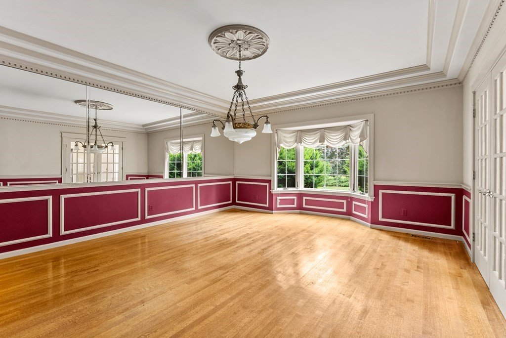 26 Fox Run Road Sudbury, MA 01776 - Photo 8 of 42 a view of a kitchen with furniture a flat screen tv and a chandelier