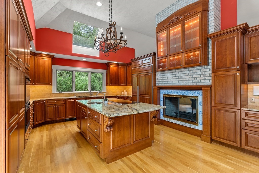 26 Fox Run Road Sudbury, MA 01776 - Photo 10 of 42 a kitchen with stainless steel appliances granite countertop a stove and refrigerator