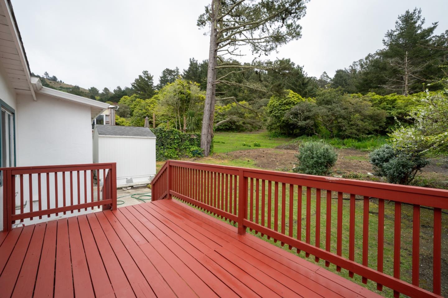 616 Brighton Road Pacifica, CA 94044 - Photo 9 of 14 a view of a wooden deck with a yard