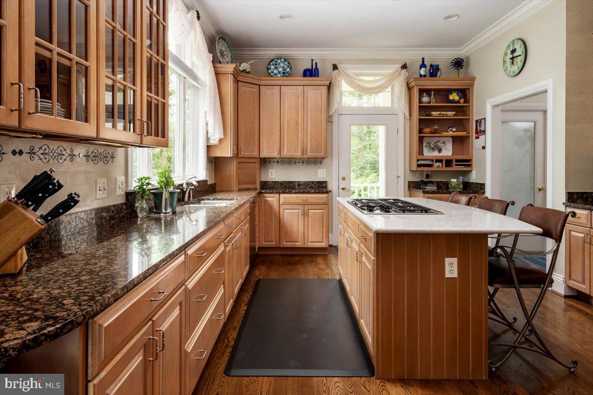 3332 Breckenridge Way Riva, MD 21140 - Photo 19 of 50 a kitchen with stainless steel appliances granite countertop a sink stove and cabinets