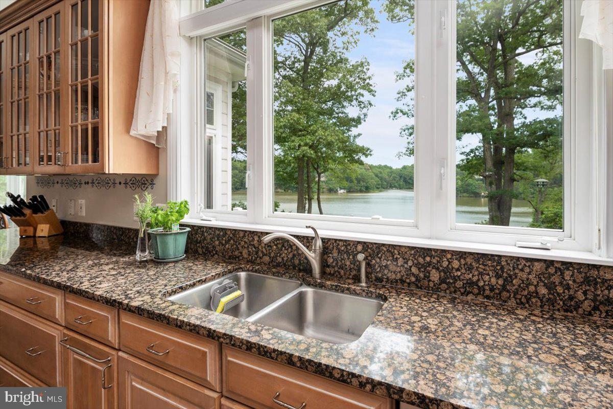 3332 Breckenridge Way Riva, MD 21140 - Photo 22 of 50 a kitchen with granite countertop a sink and a window