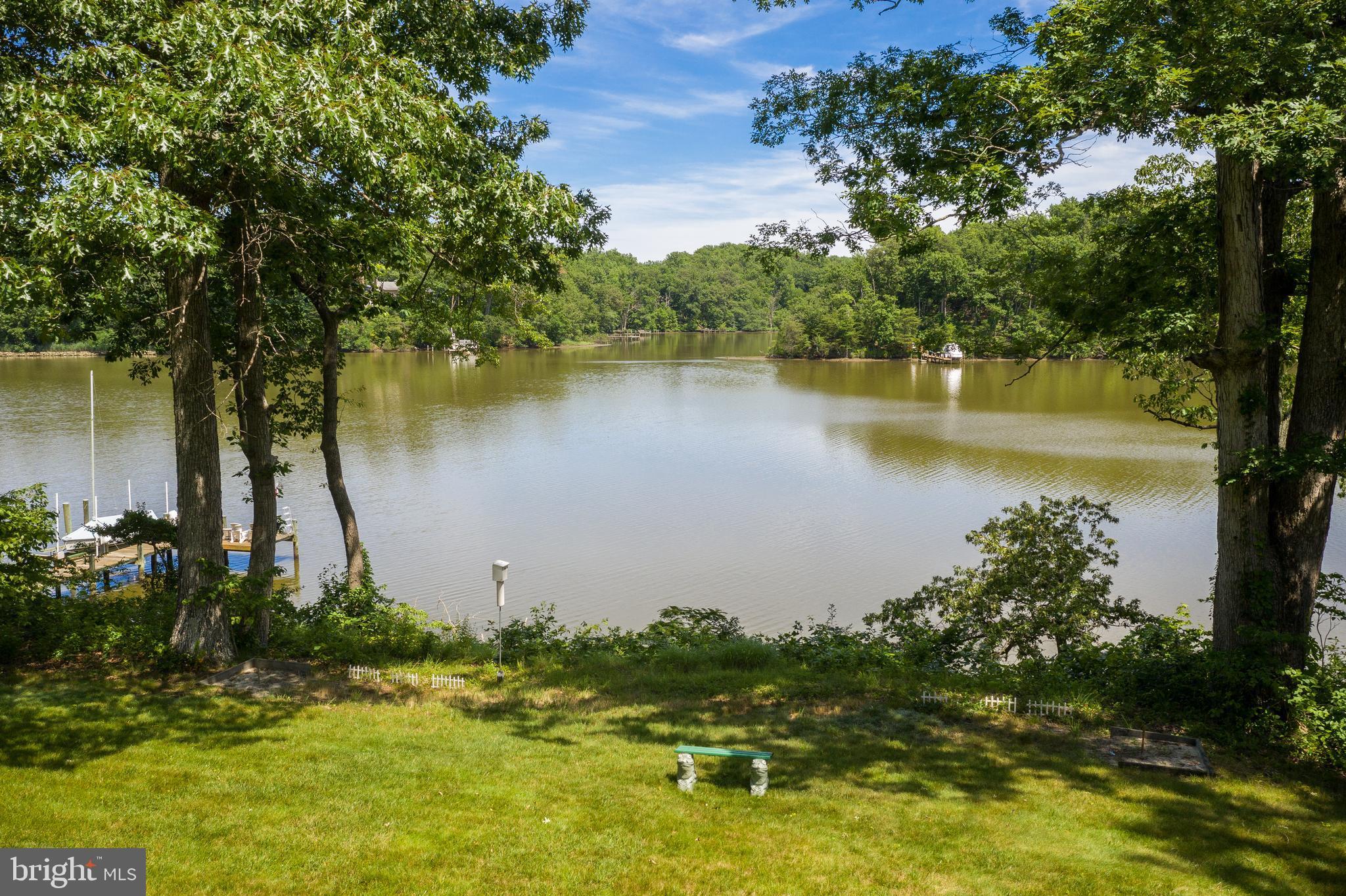 3332 Breckenridge Way Riva, MD 21140 - Photo 3 of 50 a view of a lake with a house in the background