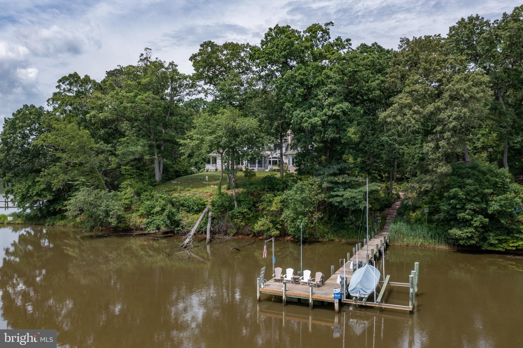 3332 Breckenridge Way Riva, MD 21140 - Photo 45 of 50 a view of a lake with boats and trees in the background