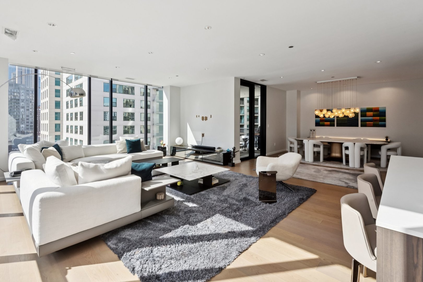 56 West Huron Street, Unit 9 Chicago, IL 60654 - Photo 2 of 38 a living room with fireplace furniture and a large window