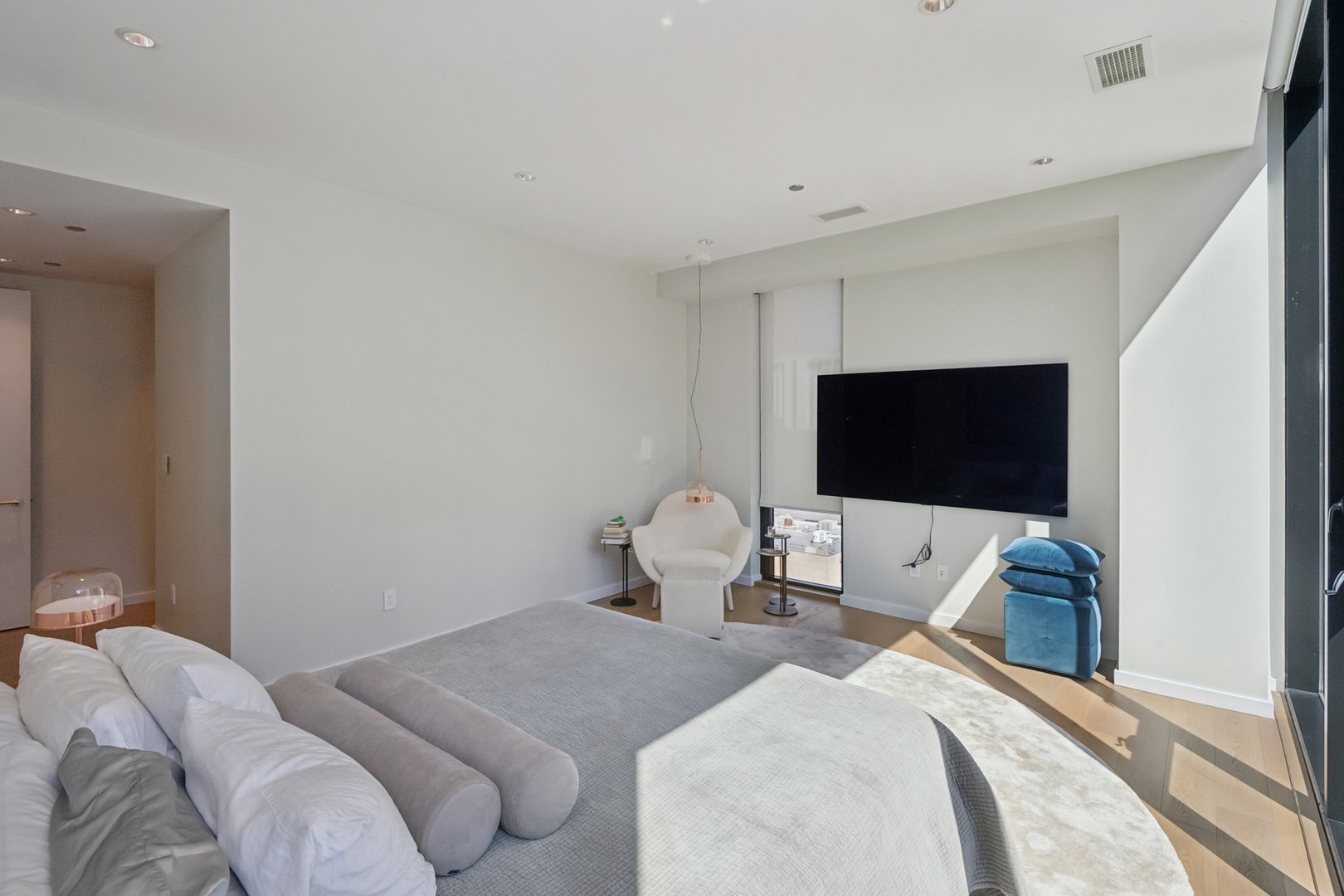 56 West Huron Street, Unit 9 Chicago, IL 60654 - Photo 24 of 38 a bedroom with a bed and a flat screen tv