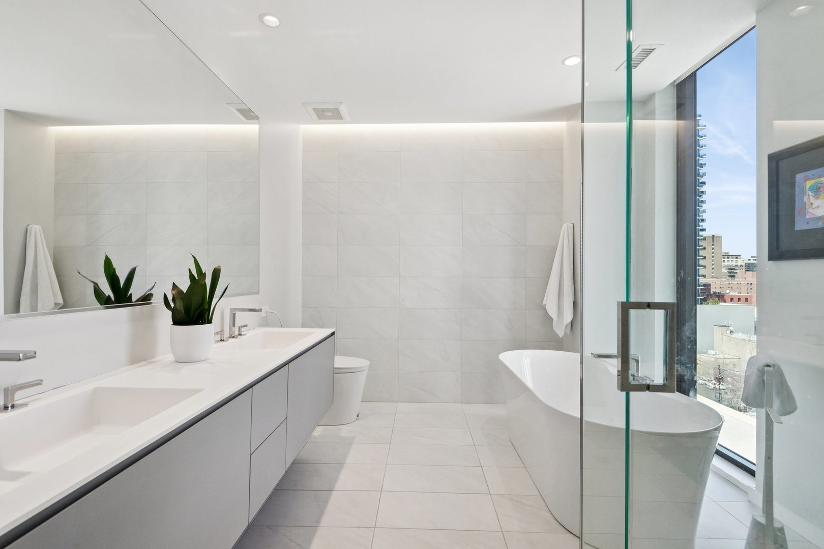 56 West Huron Street, Unit 9 Chicago, IL 60654 - Photo 25 of 38 a bathroom with a sink a toilet and shower