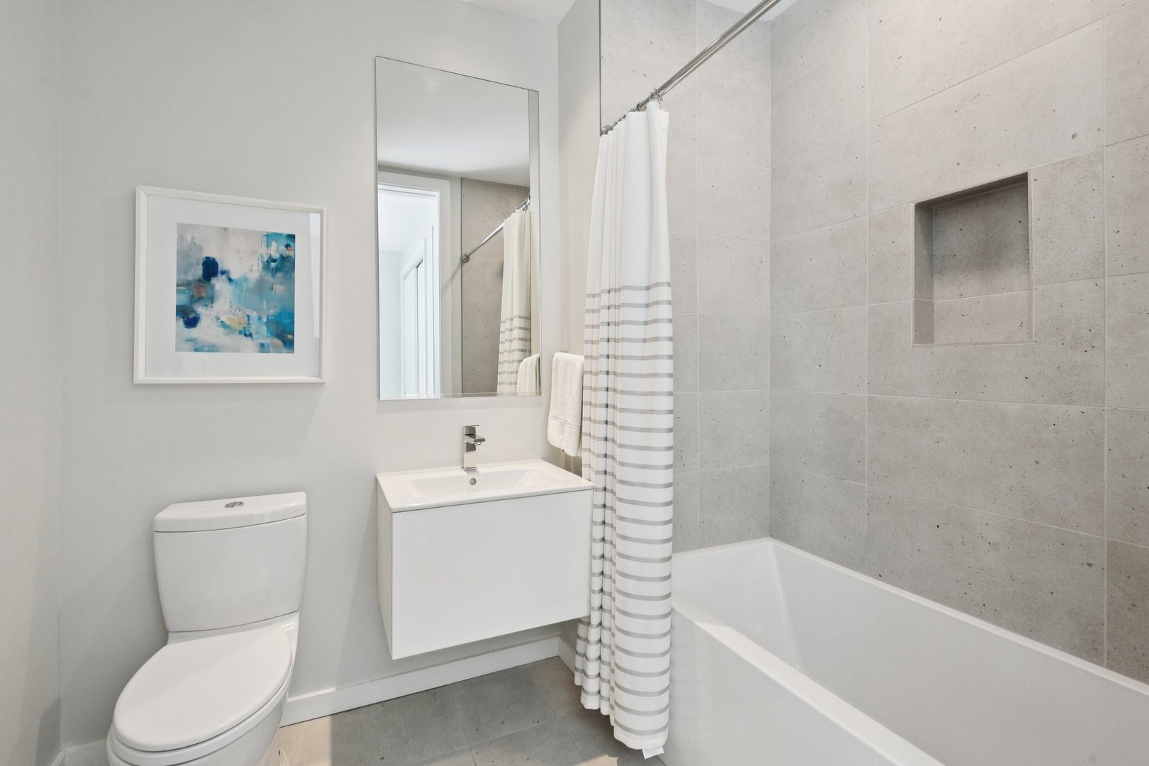 56 West Huron Street, Unit 9 Chicago, IL 60654 - Photo 30 of 38 a bathroom with a toilet a sink and bathtub