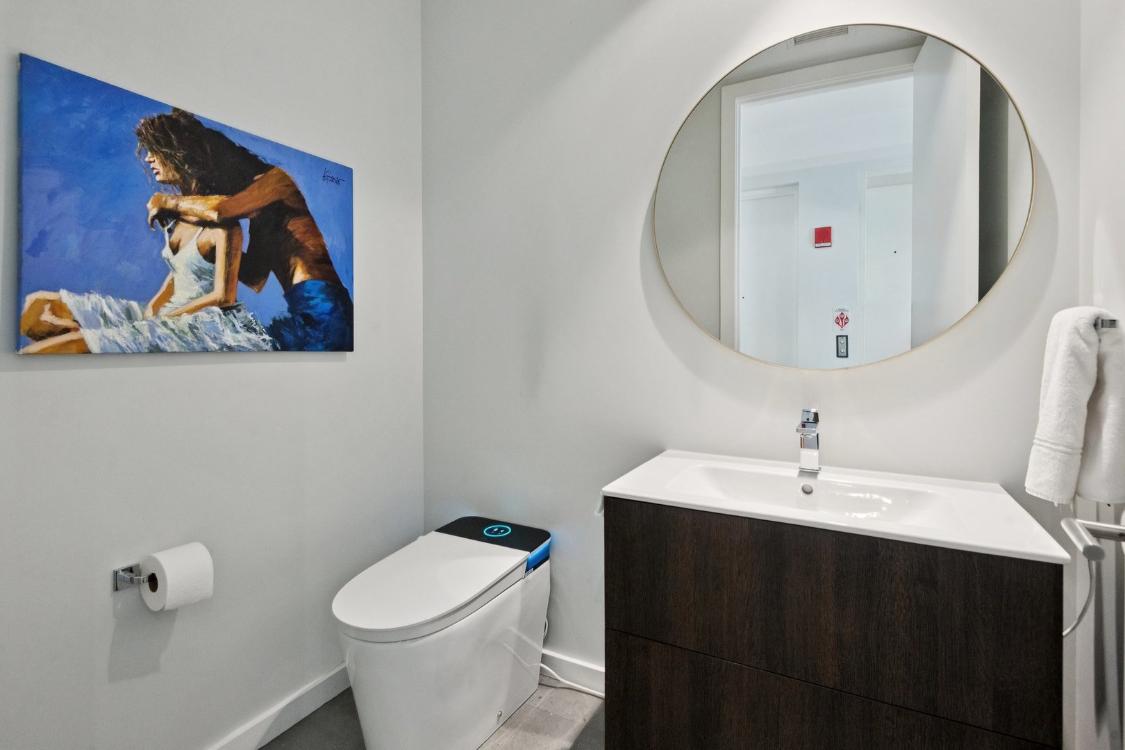 56 West Huron Street, Unit 9 Chicago, IL 60654 - Photo 34 of 38 a bathroom with a sink mirror and toilet