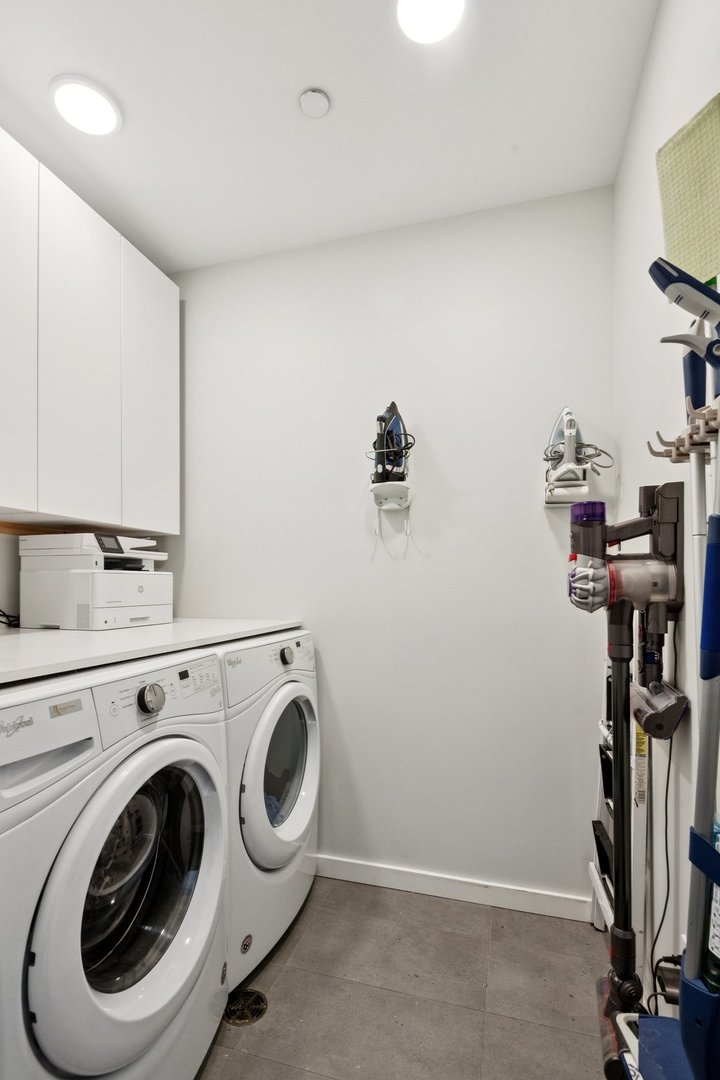56 West Huron Street, Unit 9 Chicago, IL 60654 - Photo 35 of 38 a utility room with dryer and washer