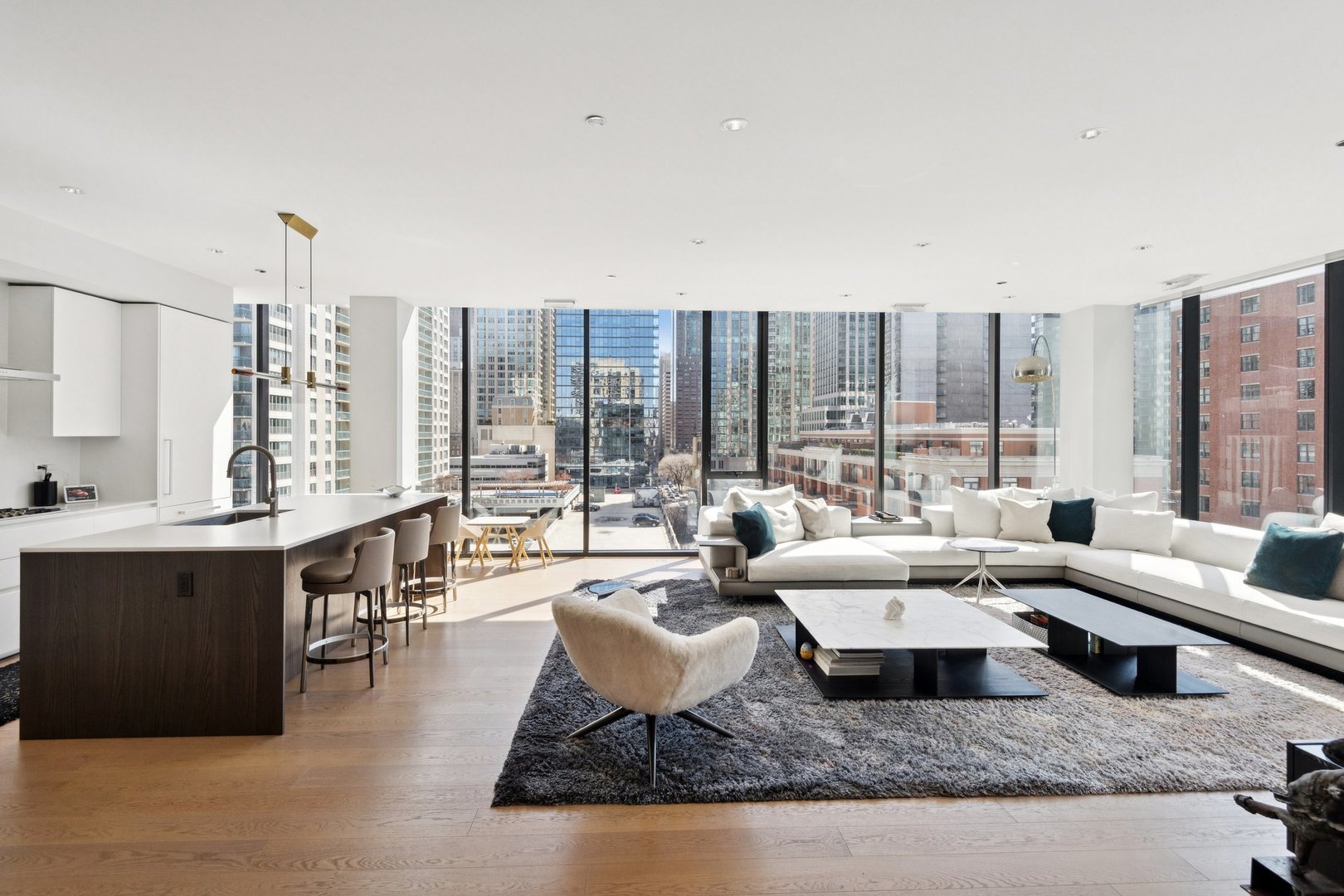 56 West Huron Street, Unit 9 Chicago, IL 60654 - Photo 5 of 38 a living room with furniture and a large window