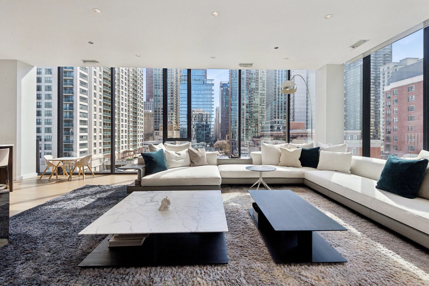 56 West Huron Street, Unit 9 Chicago, IL 60654 - Photo 6 of 38 a living room with furniture and large windows