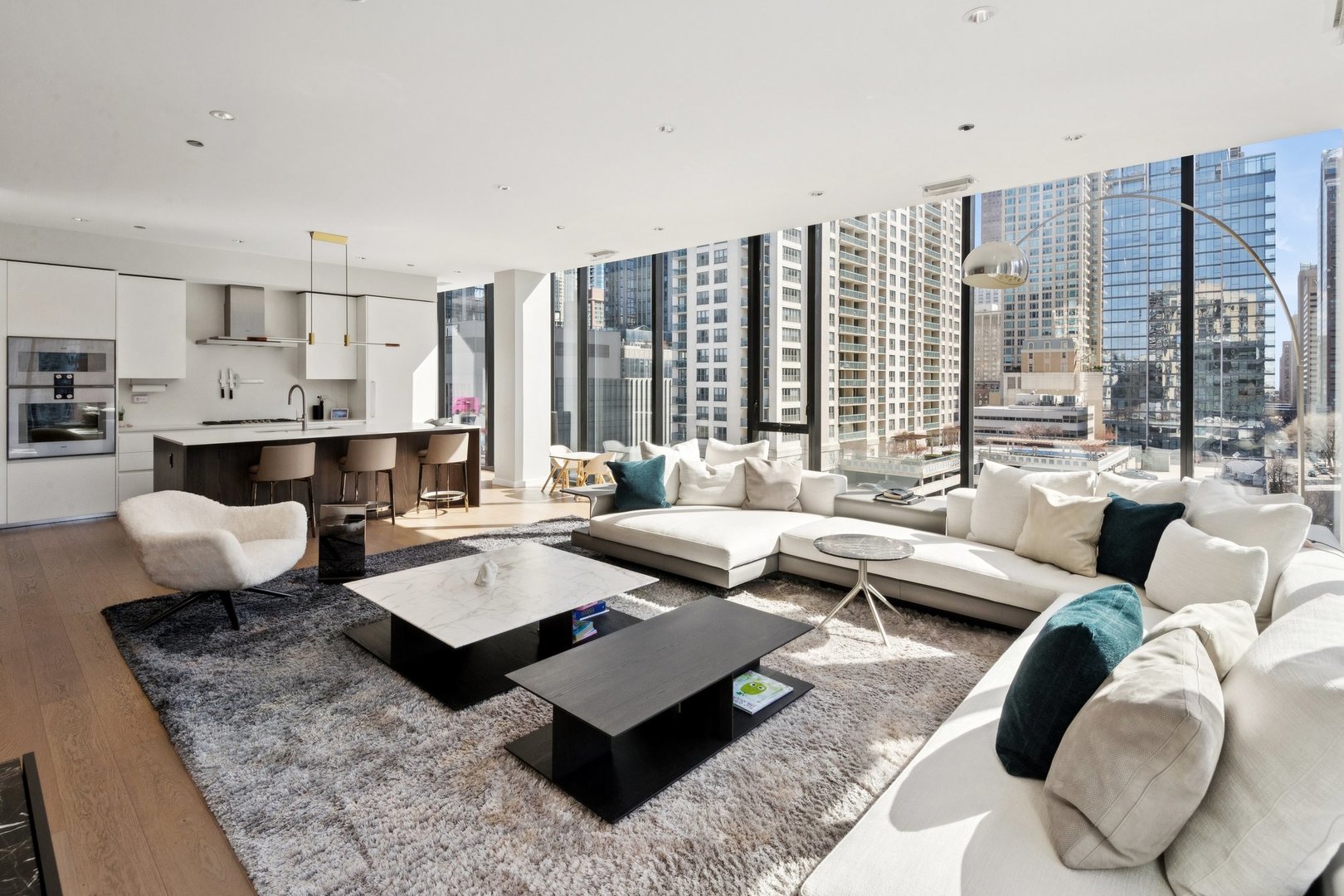 56 West Huron Street, Unit 9 Chicago, IL 60654 - Photo 7 of 38 a living room with furniture and large windows