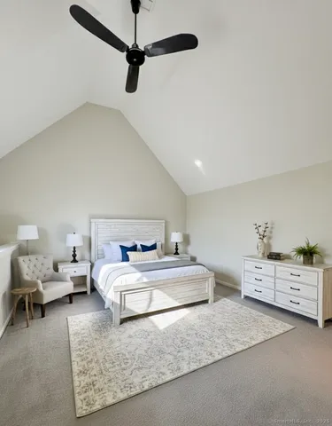 a bedroom with a bed and a chair