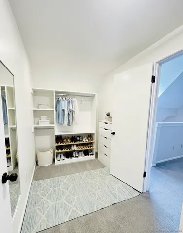 a view of work space with furniture and windows