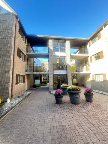 a living room with furniture and outdoor space
