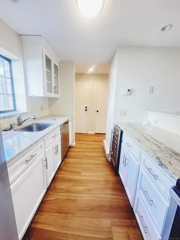 a spacious bathroom with double vanity and mirrors