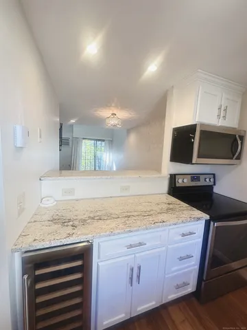a kitchen with a stove microwave and refrigerator