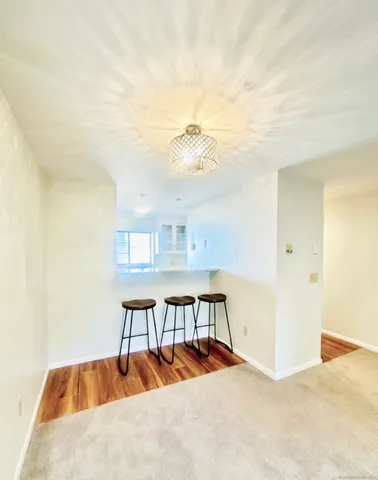 a view of a livingroom with furniture and wooden floor