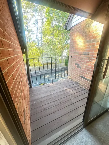 a view of wooden floor with a glass door