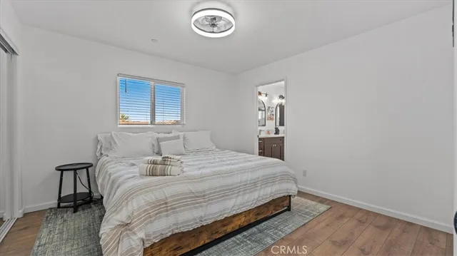 a spacious bathroom with a double vanity sink and a mirror