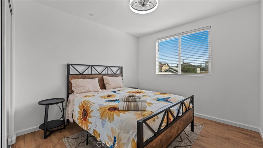 1475 North Holly Avenue Colton, CA 92324 - Photo 15 of 45 a bedroom with a bed and a window