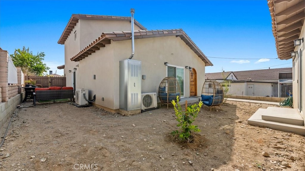 1475 North Holly Avenue Colton, CA 92324 - Photo 19 of 45 a view of a house with a patio
