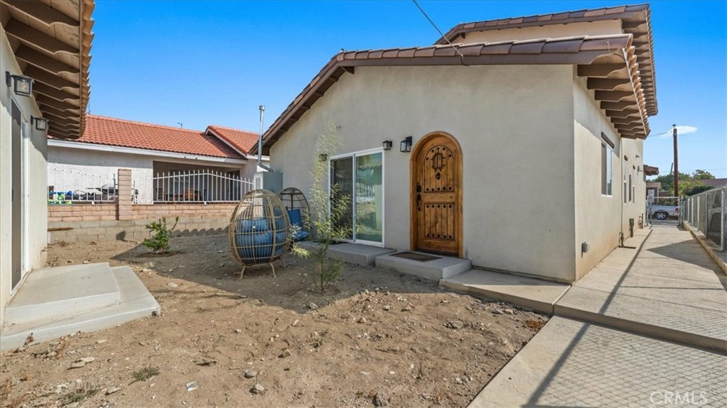 1475 North Holly Avenue Colton, CA 92324 - Photo 20 of 45 a front view of a house with garden
