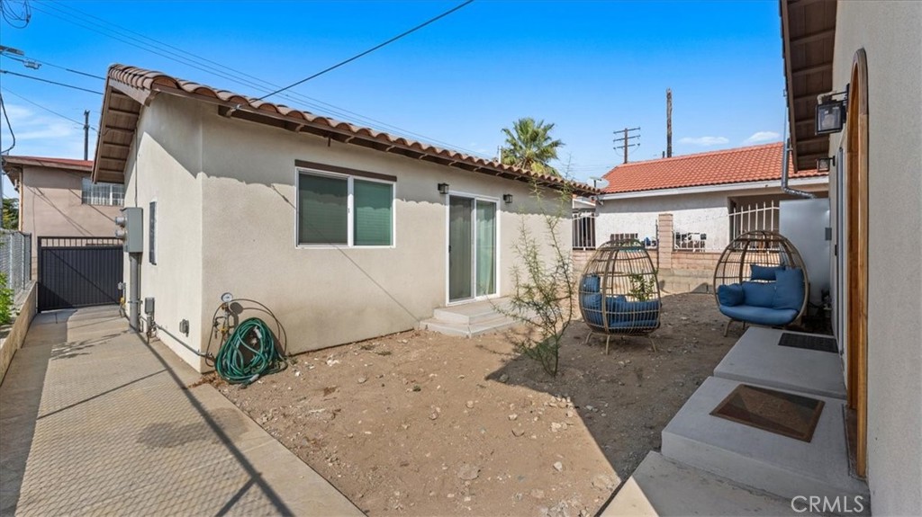 1475 North Holly Avenue Colton, CA 92324 - Photo 21 of 45 a view of a house with backyard