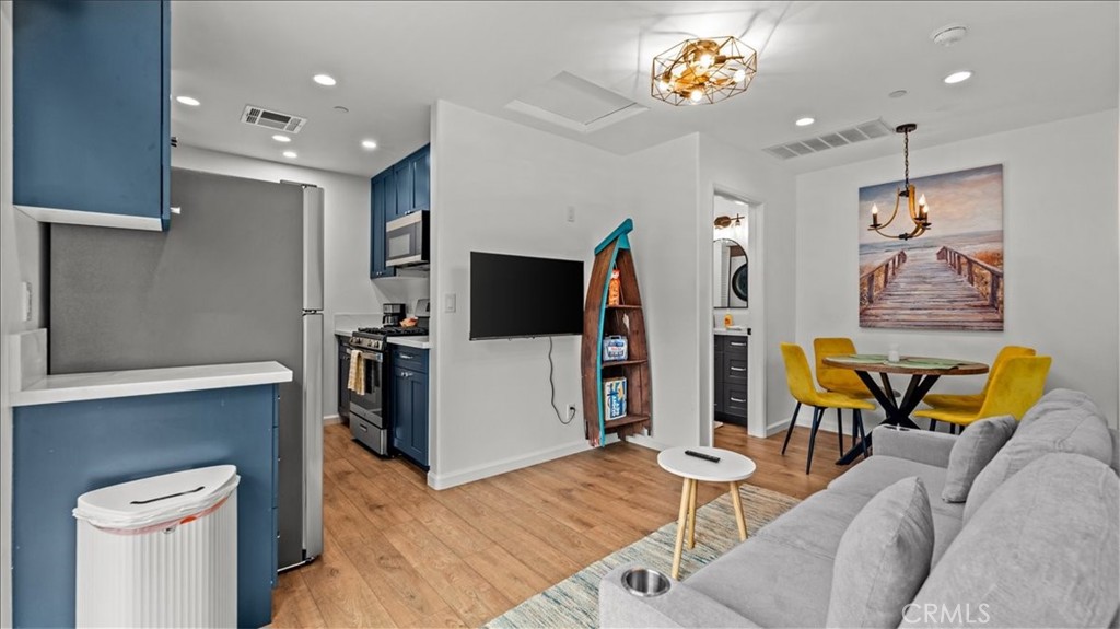 1475 North Holly Avenue Colton, CA 92324 - Photo 23 of 45 a living room with furniture and a flat screen tv