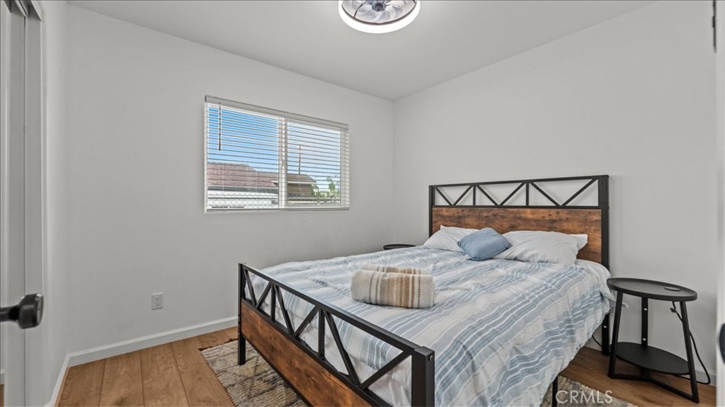 1475 North Holly Avenue Colton, CA 92324 - Photo 25 of 45 a bedroom with a bed and a window