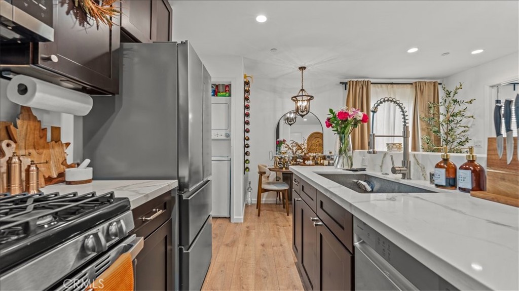 1475 North Holly Avenue Colton, CA 92324 - Photo 30 of 45 a kitchen with stainless steel appliances granite countertop a stove and a sink