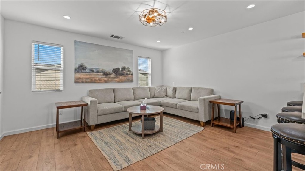 1475 North Holly Avenue Colton, CA 92324 - Photo 5 of 45 a living room with furniture and a wooden floor