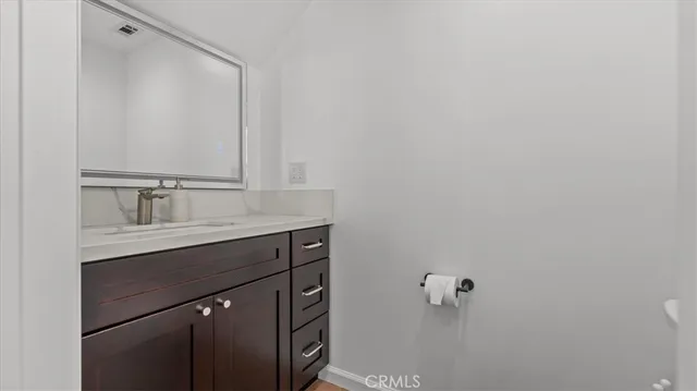 a bathroom with a sink and mirror