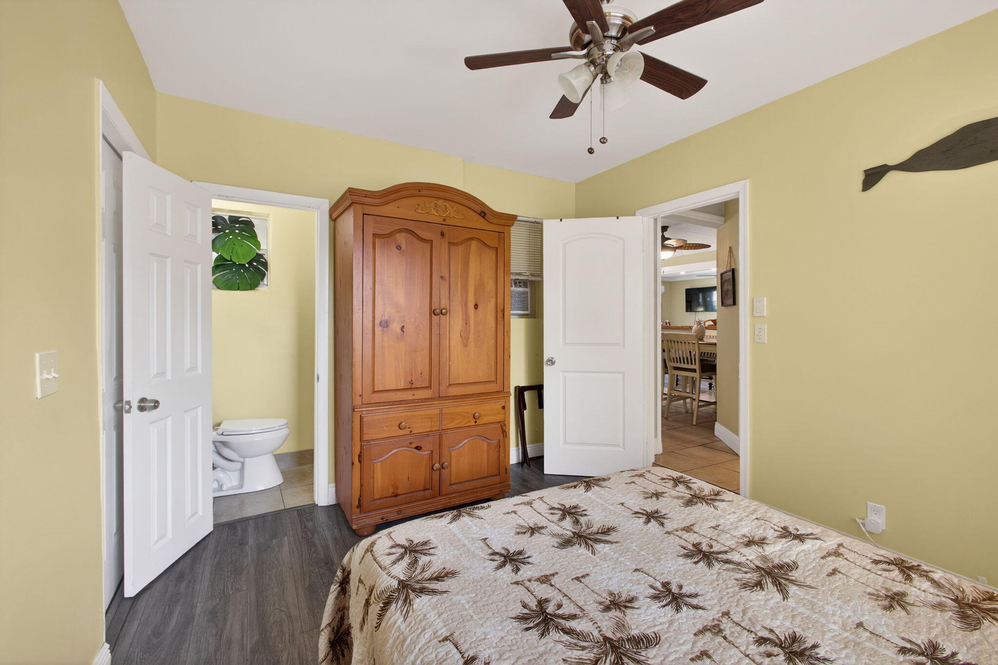 1901 Redbank Road North Palm Beach, FL 33408 - Photo 16 of 38 a bedroom with a bed and a chandelier