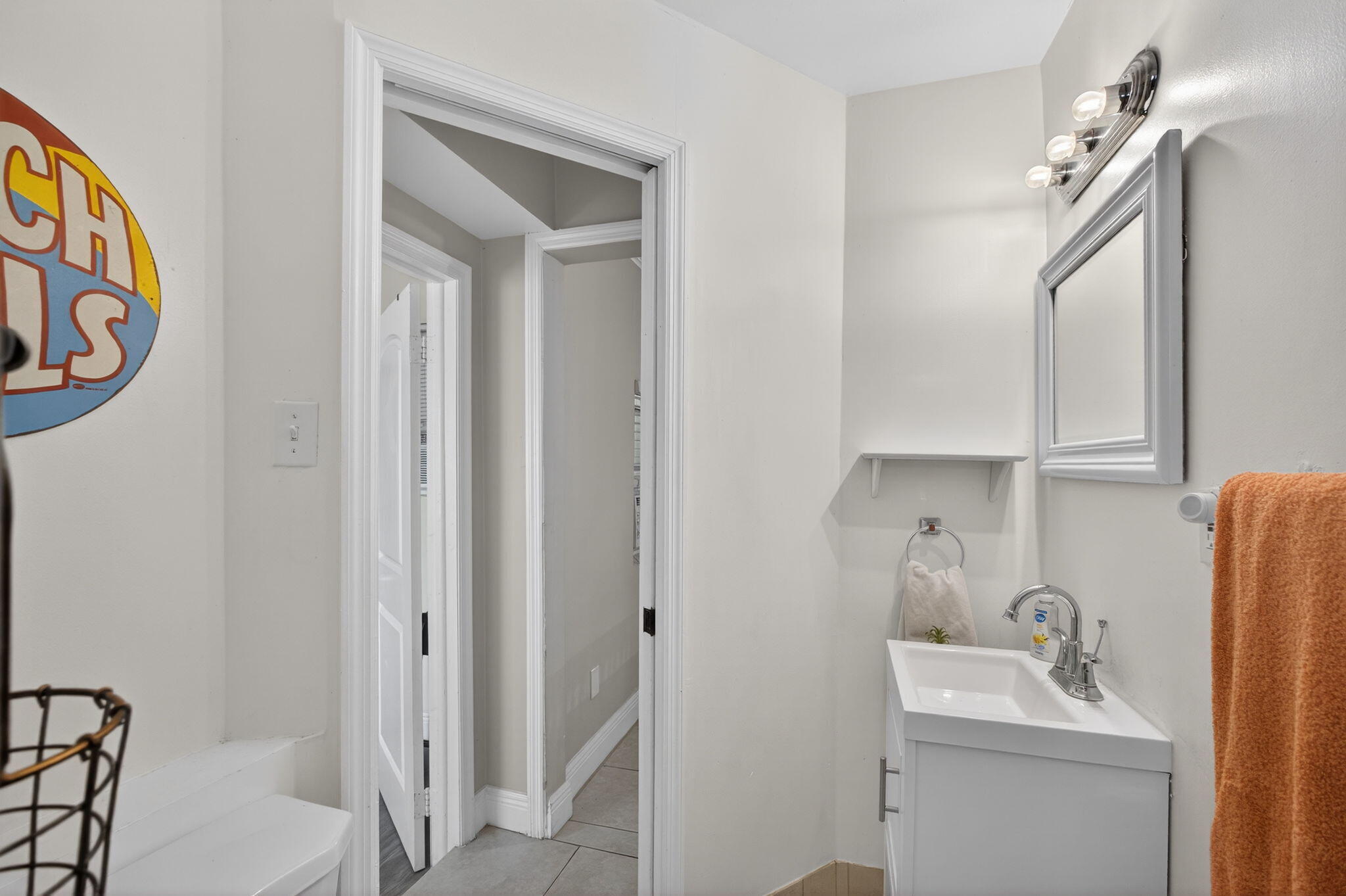 1901 Redbank Road North Palm Beach, FL 33408 - Photo 22 of 38 a bathroom with a sink and a mirror