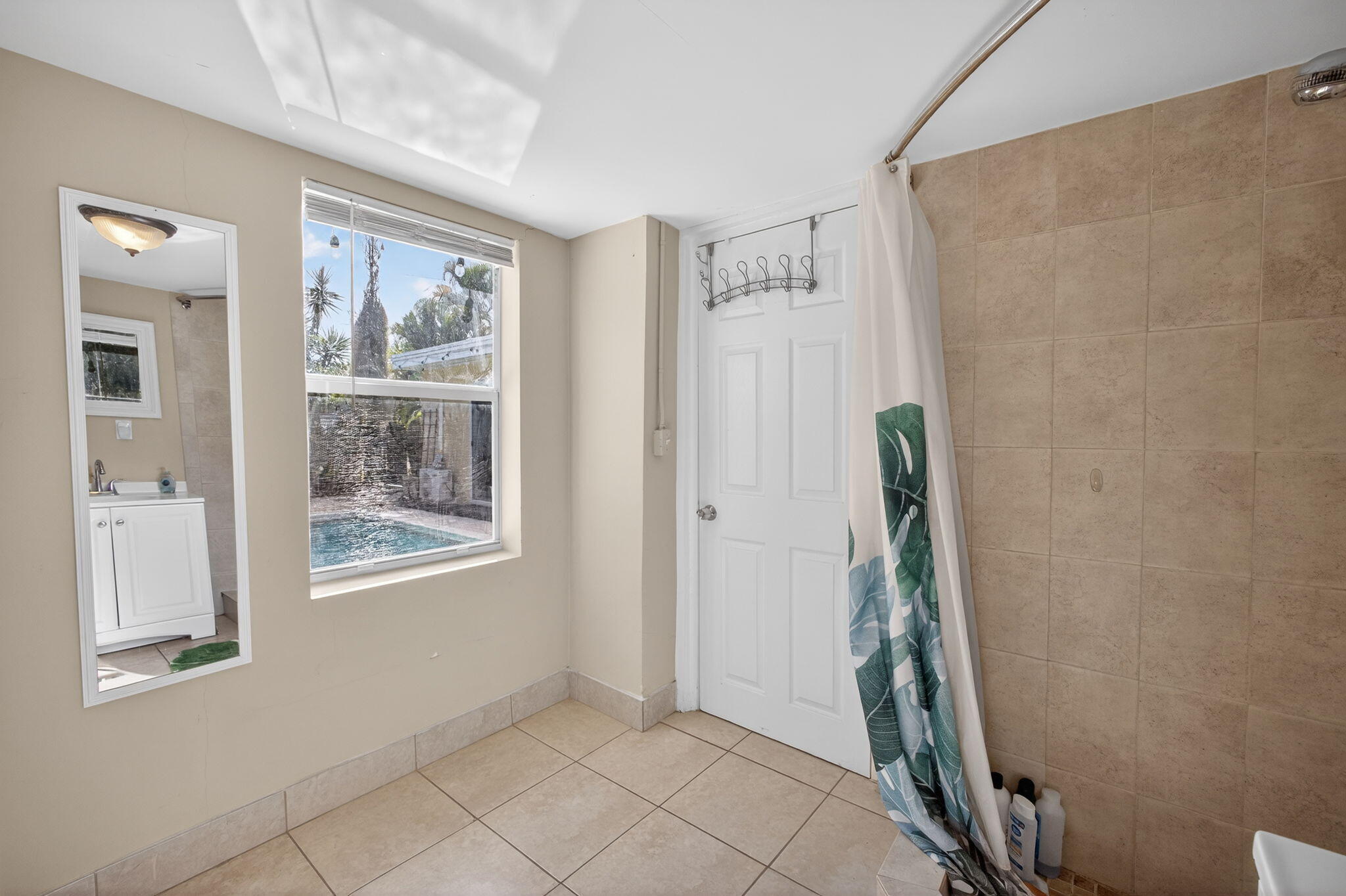 1901 Redbank Road North Palm Beach, FL 33408 - Photo 29 of 38 a view of an empty room with window and closet
