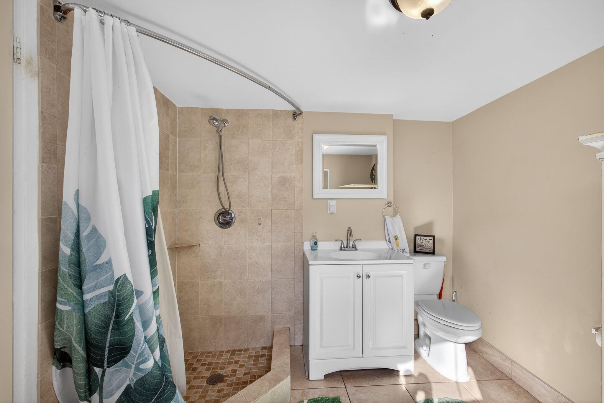 1901 Redbank Road North Palm Beach, FL 33408 - Photo 30 of 38 a bathroom with a granite countertop shower a sink and a mirror