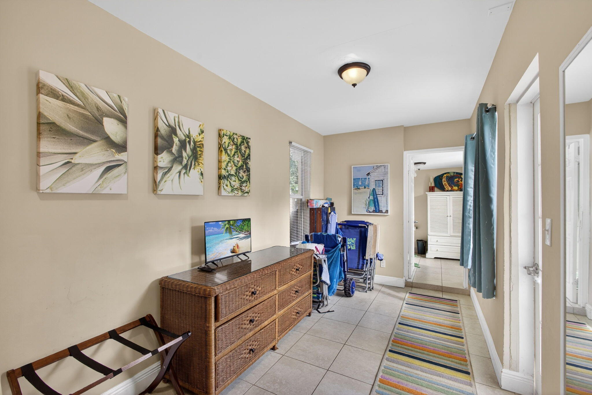 1901 Redbank Road North Palm Beach, FL 33408 - Photo 34 of 38 a room with a couch and a window