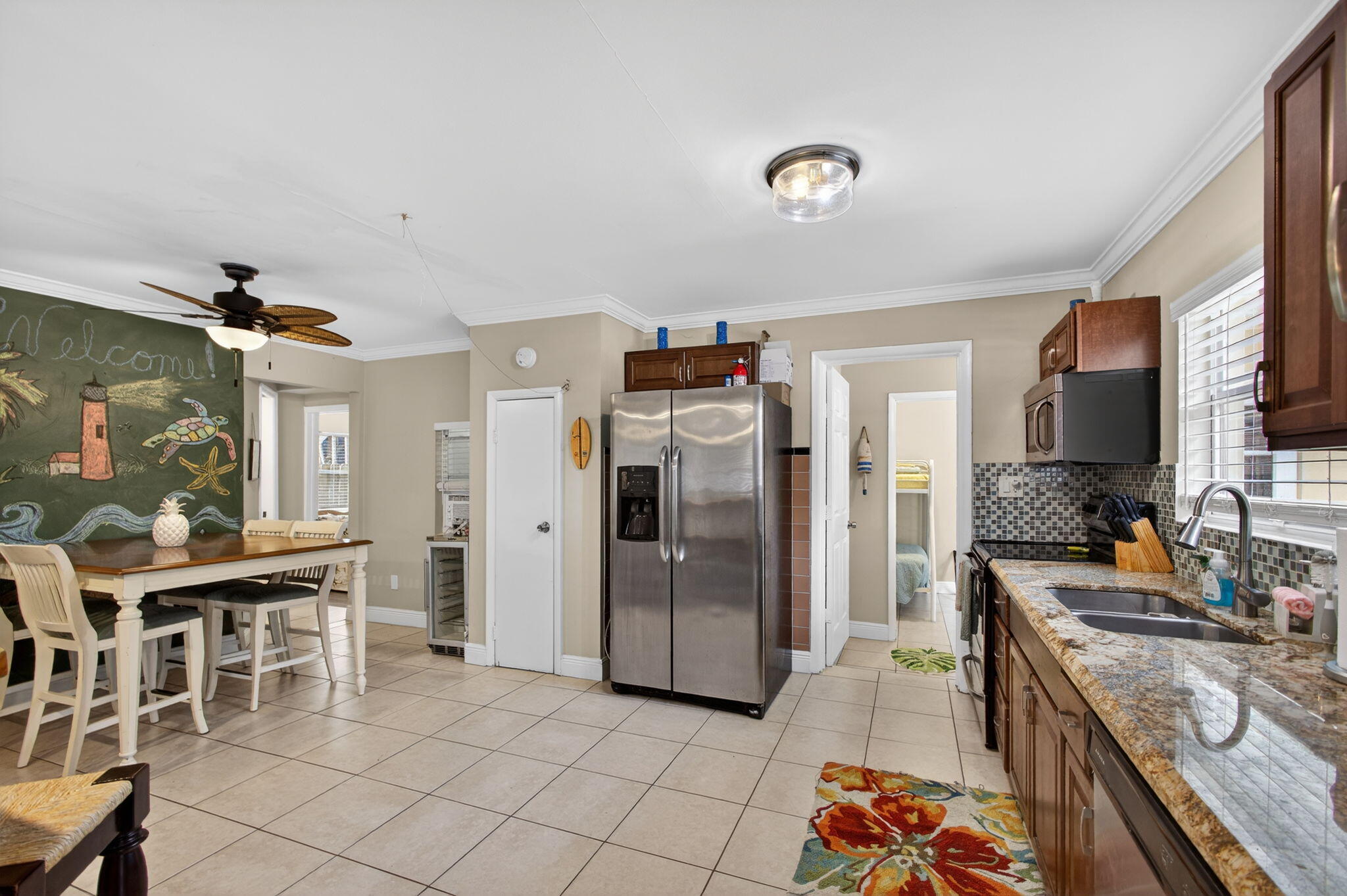 1901 Redbank Road North Palm Beach, FL 33408 - Photo 8 of 38 a kitchen with stainless steel appliances granite countertop a refrigerator and a stove top oven