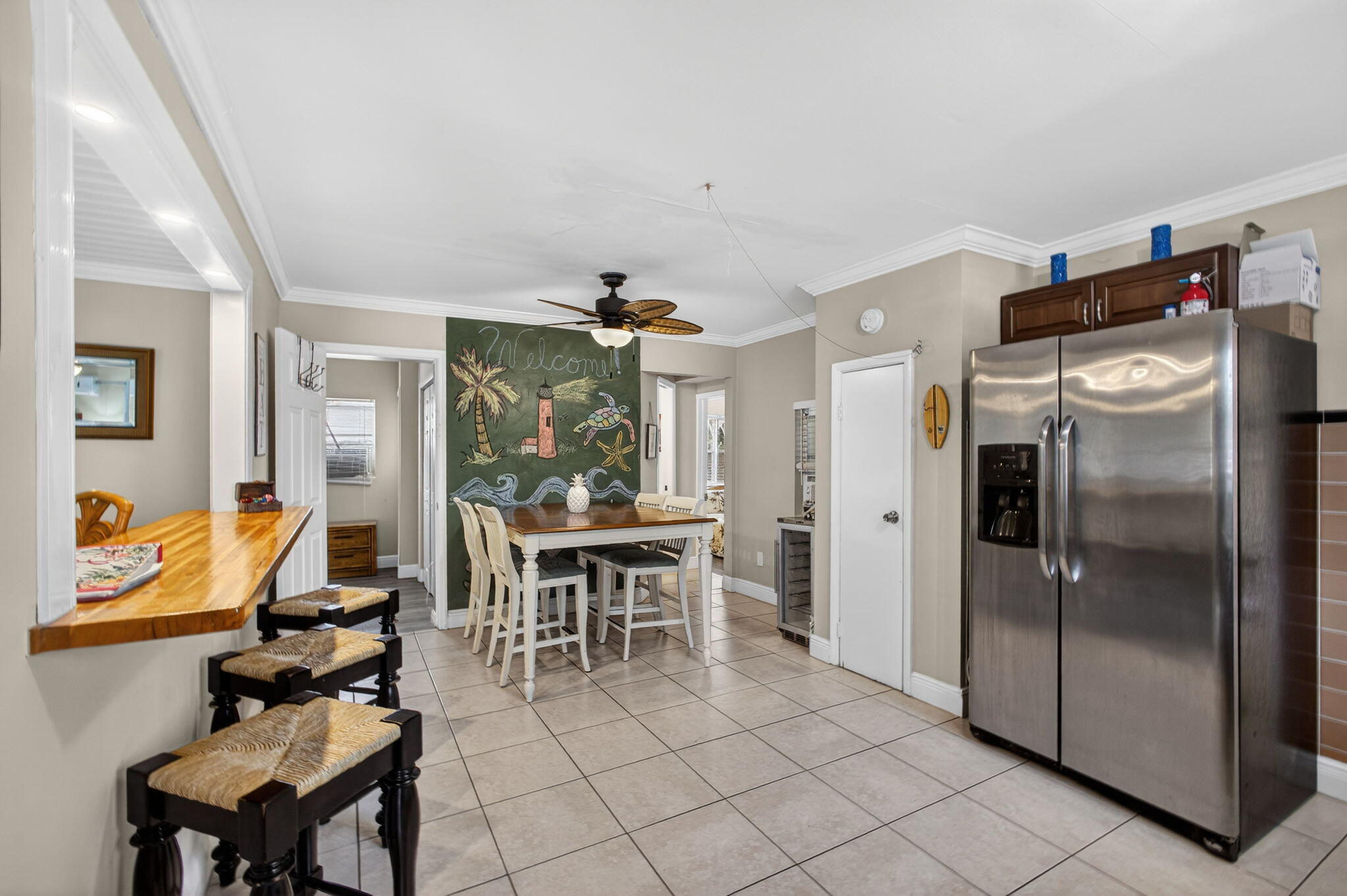 1901 Redbank Road North Palm Beach, FL 33408 - Photo 9 of 38 a kitchen with stainless steel appliances granite countertop a refrigerator and a sink