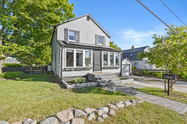a front view of a house with garden