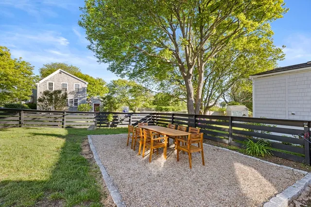 a view of a swimming pool with a table and chairs