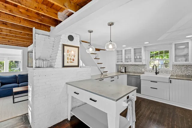 a kitchen that has a lot of cabinets in it