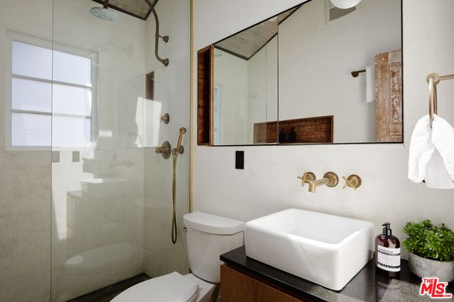 a white bath tub sitting next to a white toilet