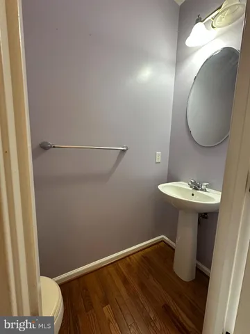 a bathroom with a sink mirror and vanity
