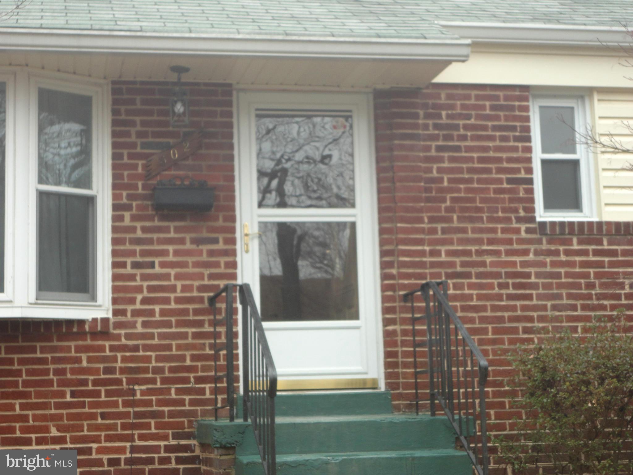 502 Royalton Road Silver Spring, MD 20901 - Photo 22 of 22 a view of a brick house with a large window