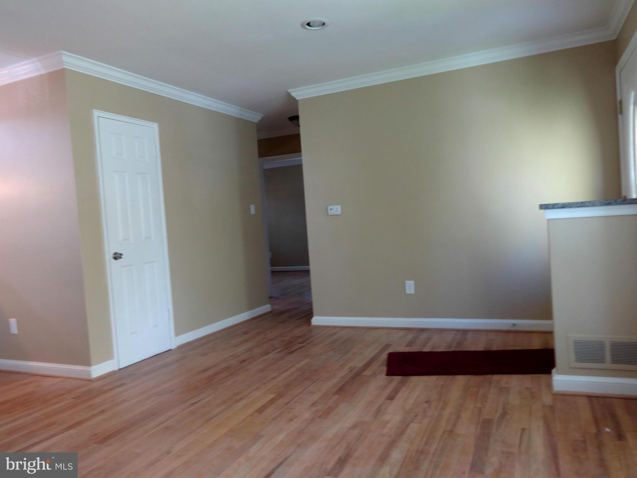 502 Royalton Road Silver Spring, MD 20901 - Photo 4 of 22 a view of room with window and wooden floor