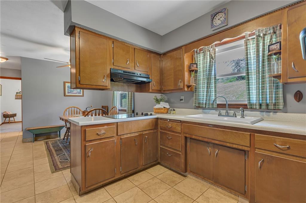 383 Ridgemont Drive Midland, PA 15059 - Photo 23 of 44 a kitchen with a sink and cabinets