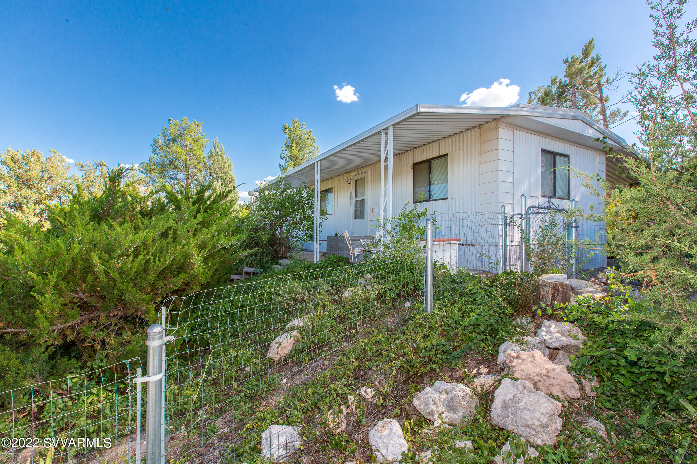 3765 East Valley Vista Road Rimrock, AZ 86335 - Photo 1 of 20 a front view of a house with a yard