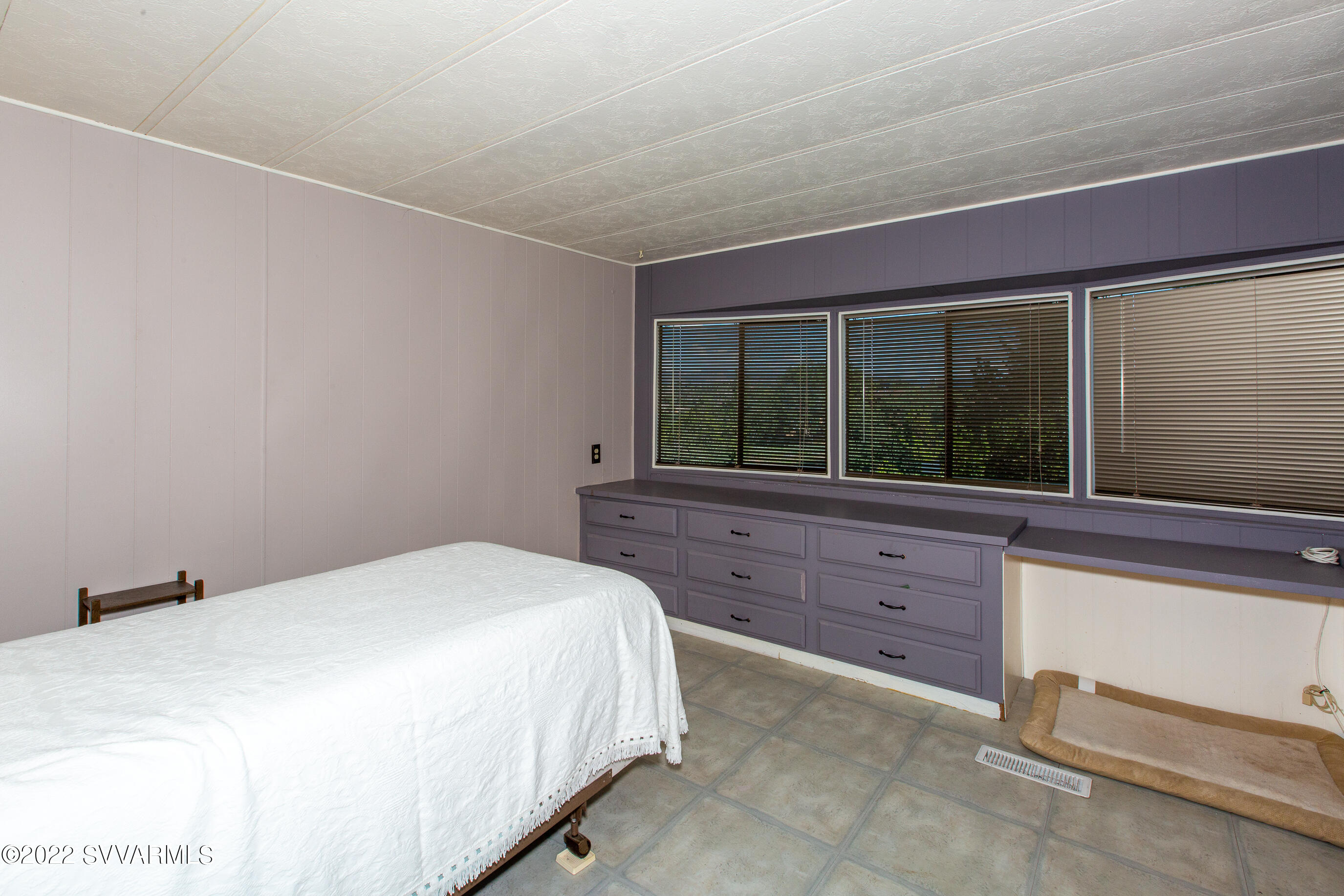 3765 East Valley Vista Road Rimrock, AZ 86335 - Photo 11 of 20 a bedroom with a bed and a large window